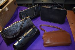 Five good sized vintage clasp top handbags.