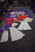 A varied selection of predominantly childrens mixed vintage and antique clothing and costumes also a