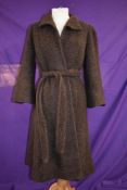 A vintage 1960s brown wool or wool blend coat by Stirling Cooper having tie belt to waist.