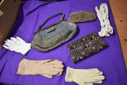 A small lot of ladies accessories including art deco Egyptian styled clutch bag and gloves.