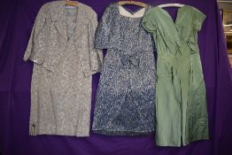 Three 1950s and 60s dresses, including pale green satin gown.