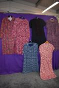 Seven vintage and retro dresses,including colourful prints, mixed styles and sizes.