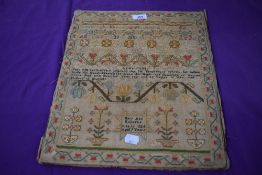 An intricate sampler by Mary Ann Roberts,age 9, dated 16th of June 1824.