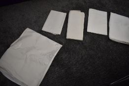 Four large antique damask tablecloths and another similar embroidered table cloth.