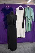 A selection of vintage dresses including 1960s linen maxi dress and blue velvet 1950s dress.
