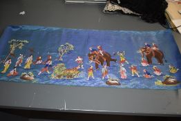 A vintage silk panel having painted Indian scenes.