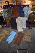 A good collection of ladies vintage and retro dresses and a blouse.