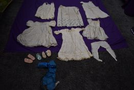 A collection of mixed antique childrens clothing and gowns.