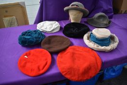 Nine mixed vintage ladies hats and berets.