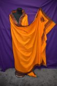 A brightly embroidered orange Kashmir wool throw or bed coverlet, single in size.