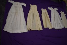 A collection of Victorian childrens under garments/pinafores in wool and cotton dresses, some lovely