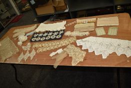 A mixed lot of lace and crotchet including lengths on card and embroidered letter.