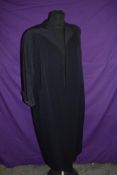 A Navy blue Harvey Nichols swing coat having silk lining and 3/4 sleeves, around 1950s.