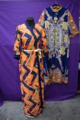 Two 1960s/70s ladies dressing gowns or house coats having bright patterns.