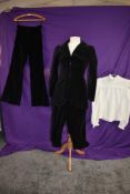 A dramatic black velvet late 1960s suit by Bus stop comprising of jacket with superb deco styling,