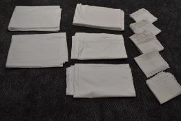 A collection of vintage bed sheets including Horrockses and pillow cases, some pillow cases with
