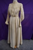 An Edwardian cream two piece outfit comprising of skirt and bodice in what feels to be a cotton/silk