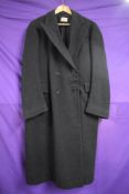 A late 1930s gents double breasted overcoat in black wool, Tom Brown label to nape.