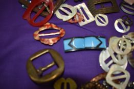 A colourful collection of vintage and antique buckles, a lot being early plastic.