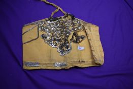 An art deco yellow taffetta bodice having extensive sequin detailing.