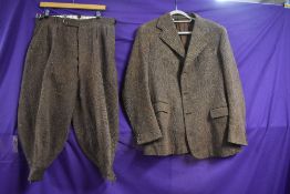 A gents 1940s single breasted tweed shooting or sporting jacket and knee britches with button fly.
