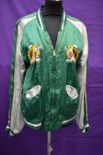 A vintage reversible souvenir jacket having embroidery detailing of Eagle to both sides and '