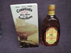 A 1970's bottle of Crawfords Five Star Blended Scotch Whisky, 70 proof, 26 2/3 fl oz, 75.7cl, in