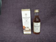 A miniature bottle of Single Highland Malt Scotch Whisky, The Macallan 10 Year Old, 40% vol, 50ml,