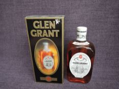 A 1970's bottle of Glen Grant 10 year old Highland Malt Scotch Whisky, 70 proof, 26 2/3 fl ozs, in