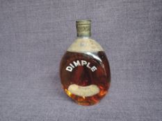 A 1950's bottle of John Haig & Co Ltd Dimple Whisky, spring cap, 70 Proof, no capacity stated