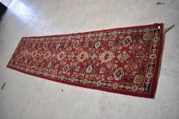 A traditional wool carpet runner, approx. 357 x 92cm