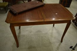 A vintage sapele extending dining tables