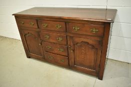 A nice quality reproduction oak sideboard in the period style, possibly Titchmarsh and Goodwin,