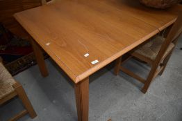 A modern/vintage oak dining table, marked for St Michael/Marks and Spencer, with integral