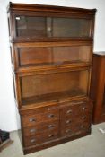 An interesting and impressive Globe Wernicke stacking bookcase having six drawer base in the