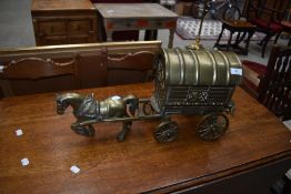A heavy brass horse and gypsy caravan