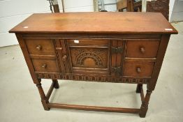 A reproduction oak sideboard of small proportions in the Titchmarsh and Goodwin style, width approx.