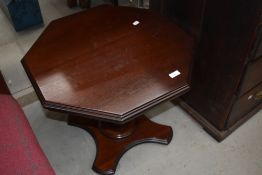 A modern stained frame occasional table having octagonal top and cross base