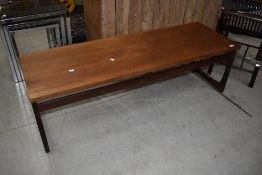 A vintage teak coffee table, stamped E Gomme (G Plan), approx. 137 x 46cm