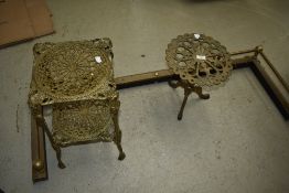 A antique brass trivet, adjustable brass fender and decorative brass etage