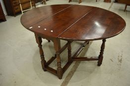 A nice quality reproduction oak gateleg table in the period style, possibly Titchmarsh and Goodwin