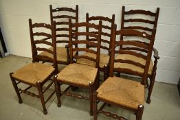 A nice quality reproduction oak set of six (four plus two) ladderback chairs in the period style,