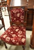 A Victorian oak salon chair having later upholstery