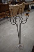 A metal six branch candle stand