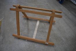 A vintage table easel labelled EJ Arnold