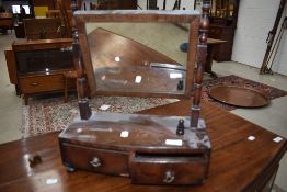 A 19th Century mahogany toilet mirror having double drawer base