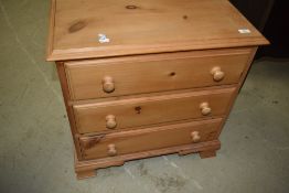 A natural pine chest of three long drawers, having tongue and groove bases, width approx. 65cm