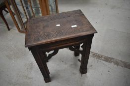 A Gothic Ecclesiastical carved oak stool or occasional table