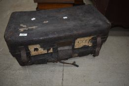 A vintage leather travel trunk