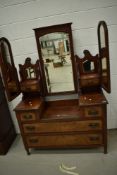 A Victorian dressing table in mahogany and walnut with multiple mirrors